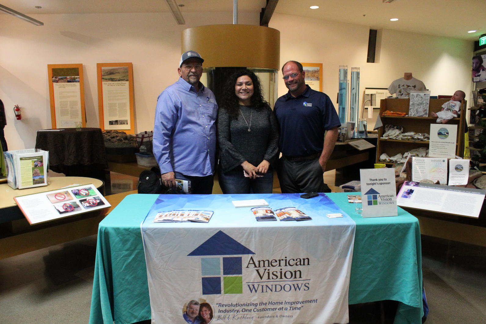 Our sponsors from American Vision Windows stand in front of their table at the end of the night.